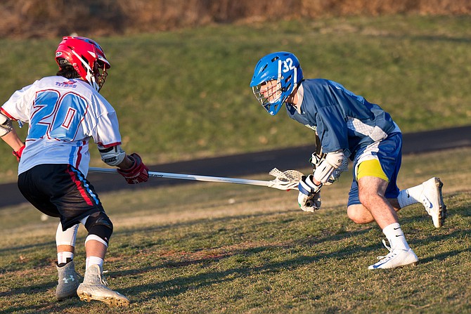 Churchill senior attackman Louis Dubick, right, is a four-­year starter for the Bulldogs and signed to play with the University of Maryland.