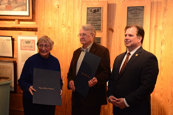 Del. Tim Hugo (R-40), right, recognizes former Friends of Fairfax Station president Joan Rogers and historian Lee Hubbard (center) at the Fairfax Station Railroad Museum.
