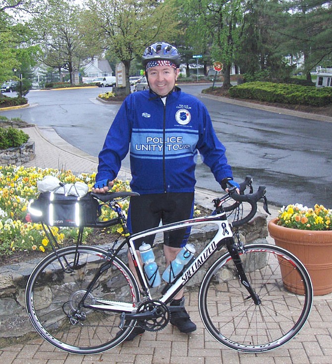 Kevin Whalen with his bike outside Centreville’s Glory Days Grill.
