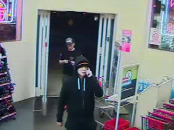Suspect is wearing dark hood/cap.