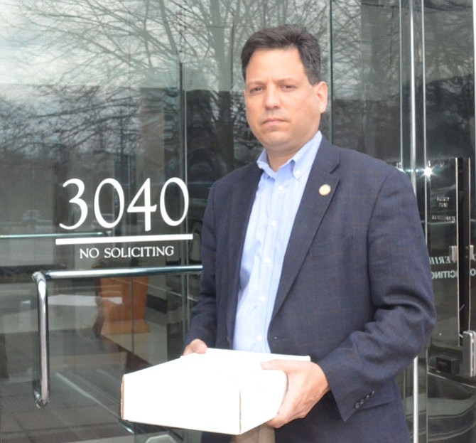 Del. Scott Surovell (D-44) delivers 500 signatures on a petition demanding widening Route 1 to the Northern Virginia Transit Authority.
