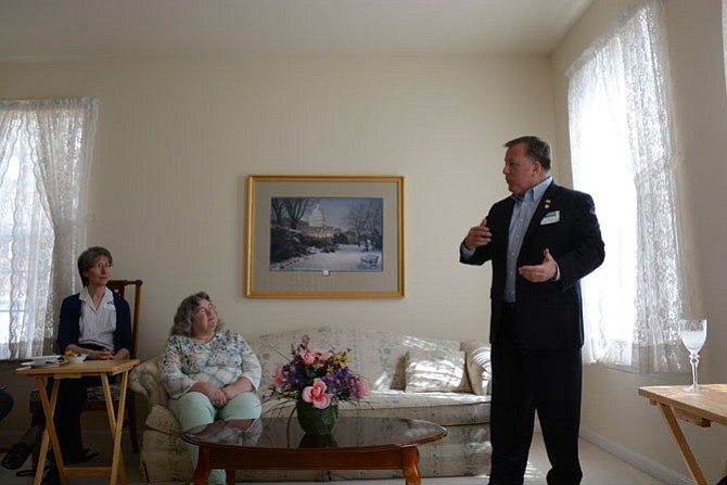 Beth Schaefer, a resident of the Franconia area of Alexandria, and Susan Valentine of the Kingstowne area of Alexandria, listen as Virginia Senate candidate and Dumfries Mayor Jerry Foreman outlined some of his campaign objectives. A meet and greet event took place in Valentine’s home.