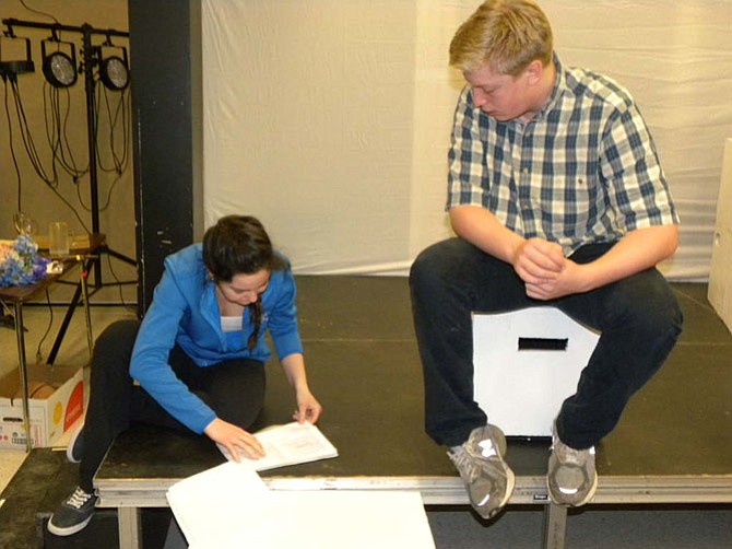 Sophomore Jessica Taylor, 15, and junior John Bucy, 17, rehearse their lines during rehearsal for Langley High School’s “Book of Days,” running April 23 to 25 at Hunter Woods Elementary School in Reston.