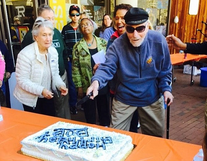 Bob Simon cuts the cake celebrating his 101st birthday on April 11, 2015.