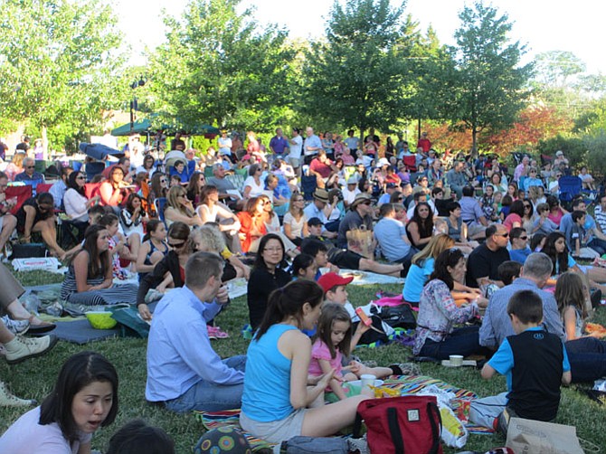 Crowds of family, friends and fans take over the Town Green in the Vienna Idol finals. Dollar votes determine the new Vienna Idol. Friends and family have been seen stuffing the ballot jars.