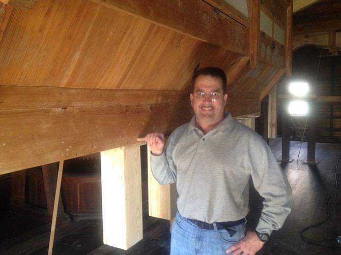 Colvin Run Mill Park manager Mike Henry near the corn bolter, a period piece which dates back to the early 19th century. It has been named ‘Elvis’ by staff members at the park. A Restoration Celebration will take place at Colvin Run Mill Historic Site on April 19, 2015.