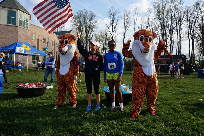 Holy Child tigers were joined last year by then freshman Kendall Soistman and then junior Tahana Augustin, who also sang the national anthem at this 2014 Tiger Trot 5K.