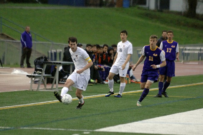 Woodson senior Zach Yaglou (11) scored a goal in the first half of Tuesday’s match against Lake Braddock.