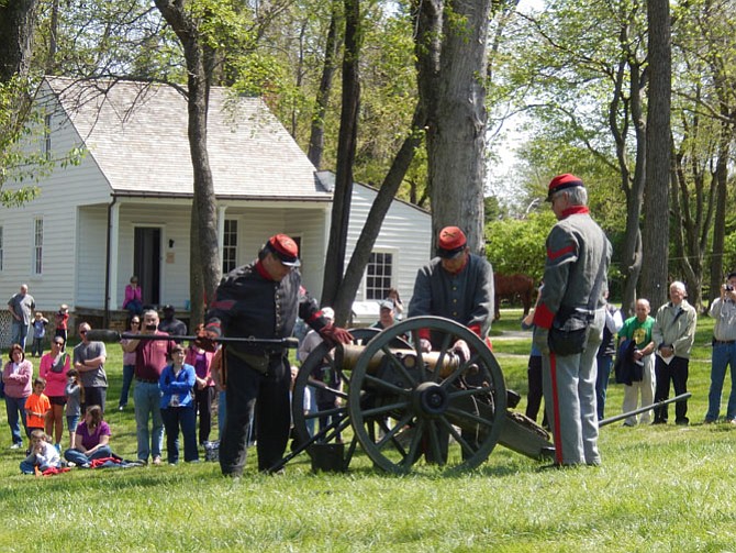 Civil War re-enactors prepare to demonstrate the firing of a cannon during last year’s event.