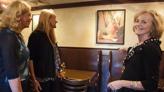 Darci Weaver and Jan Hill join Judith St. Ledger-Roty at an art show reception at Katie's Coffee House.