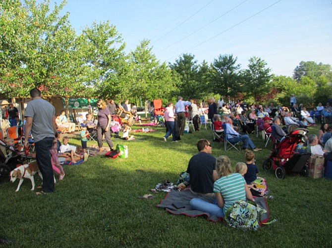 Friday and Sunday evenings, the Town Green fills with families and friends who come for live music on the stage there. 
