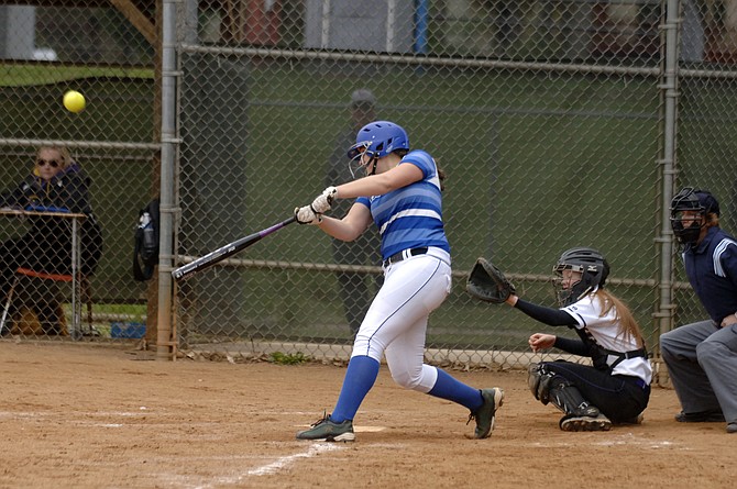 Bishop O’Connell first baseman Olivia Giaquinto smacks a three-run homer during the seventh inning of Saturday’s 9-3 win over Lake Braddock. Giaquinto finished 3-for-3, including a pair of hits in the Knights’ nine-run seventh inning.