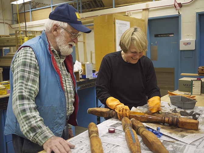 Paul Dietz teaches woodworking to Carolyn Ryffel at the Career Center.