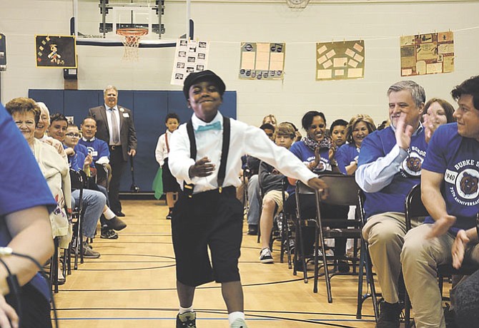 Current Burke School student Jayon Knight displayed a number of classic elements of school attire from decades ago during a fashion show for the Burke School 75th anniversary celebration.
