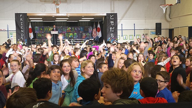 Students at Great Falls Elementary waved, enthusiastically, at cameras and special guests including First Ladies Michelle Obama and Akie Abe from Japan, on Tuesday, April 28, 2015.