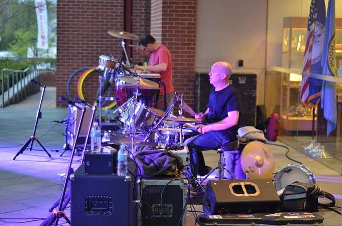 Musicians Paul Voshell on the drums and David James handled percussions at the May 2, 2014, Friday Night Live Concert at the Town of Herndon.