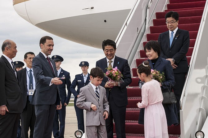 Glenn Koji vanValkenburgh greets Japan's Prime Minister Shinzo Abe and Mrs. Akie Abe as they arrive at Andrews Air Force Base on April 27.
