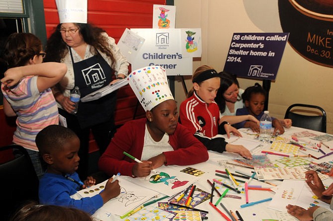 Children busy themselves coloring and decorating chefs hats in the children’s craft corner.