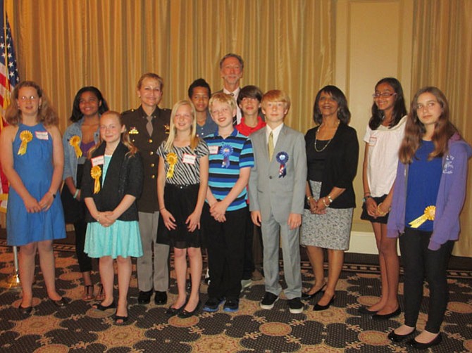 From left -- front row: Susan Weinhardt, Adison Verena, Abby Williams, Ethan Uffelman, Tyler Bechtle, Helping Hands Coordinator Pat Hackerson, Sonia Naik, and Michael Wacht. Back row: Cantara Harris, Fairfax County Sheriff Stacey Kincaid, Nicholas Yancy, Vienna Optimists president Richard Gongaware, and Hunter Moss. Not present is Kevin Molina Benitez.
