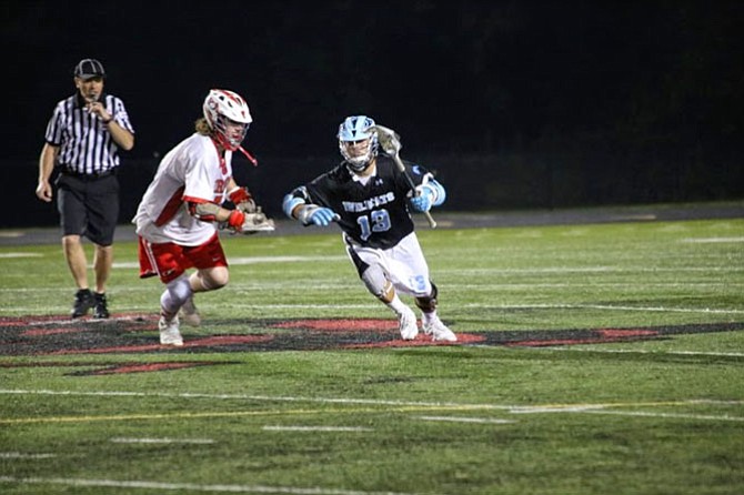 Christian Park (13) has been Centreville’s faceoff specialist this season.