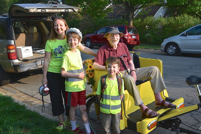 Melissa Romano, coordinator of the Lake Anne Elementary school’s Bike to School Day, with two of her children Kieran and Taric and Reston founder Robert Simon gearing up for the start of the event. 
