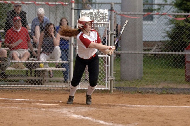 McLean senior Erin Calpin launches a walk­-off home run against Madison on May 8. The Highlanders won 1-0 on senior night.