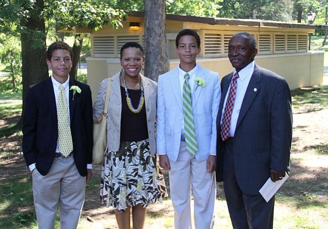 Melvin Miller with daughter Ericka and twin grandsons Zachary and Bennett at a recent school graduation.
