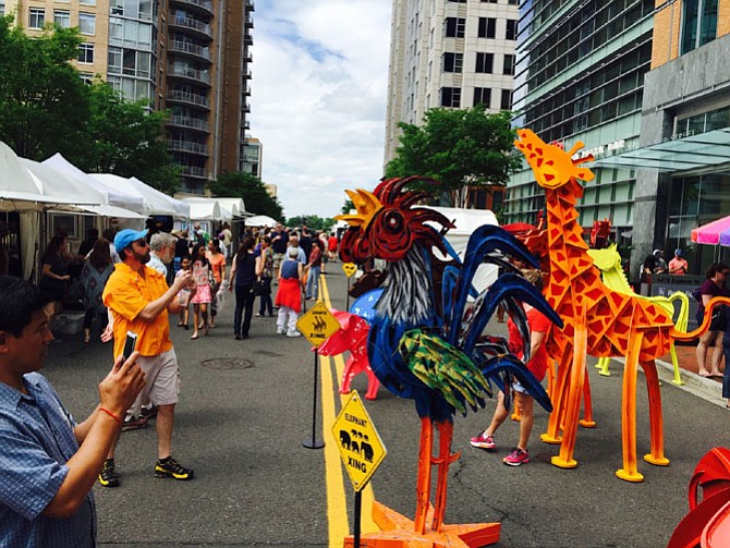 Be careful for the giraffe and elephant crossings near the center of the festival. More than 40,000 attended the annual arts festival.
