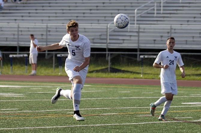 Woodson forward JW Clark (5) scored the winning goal against T.C. Williams during the Conference 7 tournament semifinals on Tuesday.