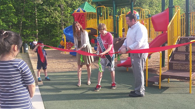 (From left) Del. Eileen Filler Corn (D-41), SCA President Ben Lajoy and Principal Ryan Richardson just moments before the ribbon was cut and children rushed onto the playground.