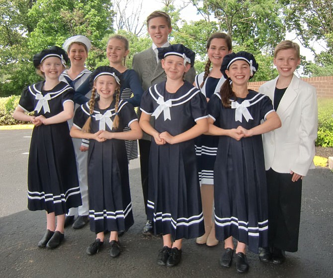 The family von Trapp includes, from left, first row, Allison Howlett (Louisa), Emily Ashman (Gretl), Madison Sherman (Brigitta), Olivia Putnam (Marta), second row, Daniel Schorr (Friedrich), Alisa McCaw (Maria), Timothy Proudkii (Captain), Ayelet Baisburd (Liesl), and Eli Langer (Kurt). Not pictured are double cast members Alexa Vinner (Gretl) and Rachel Roberts (Marta). 
 
