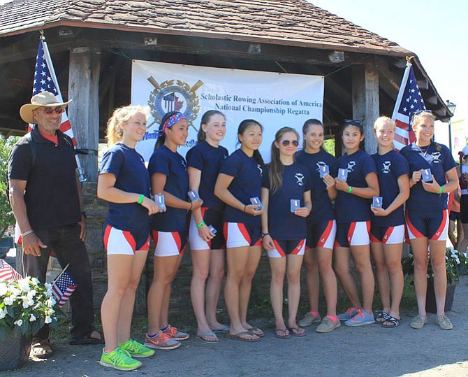 The T.C. Williams girls’ varsity light weight 8 boat accepts the bronze medal in the Scholastic Rowing Association of America’s National Championship Regatta. Pictured are coach Jaime Rubini, LeeAnn Richards, Emily De-Bodene, Caroline Hill, Sarah Scroggs, Abigail Prall Sierra Arnold, Olivia Anthony, and Rachael Vannatta.