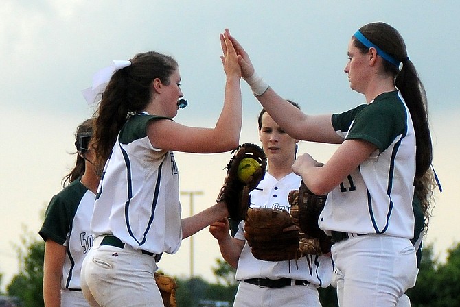 South County shortstop Cara Yates, center, drove in the game-winning during the Stallions' 2-1 win over South Lakes in the opening round of the 6A North region tournament.