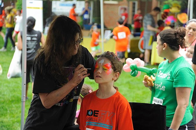 The colorful face-painting at The Joe Cassella 5K Post-race Party is always the most popular tent featured in Kids Corner.
