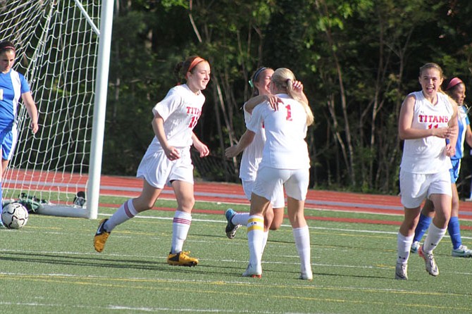 Zoe Boocock rushes over to her teammates after the Titans scored their third goal on Senior Night in 2013. 
 
