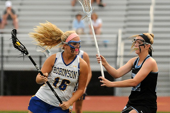 Centreville senior Caroline Wakefield, right, defends Robinson junior Kaitlin Luccarelli during the 6A state semifinals on Tuesday at Robinson Secondary School.