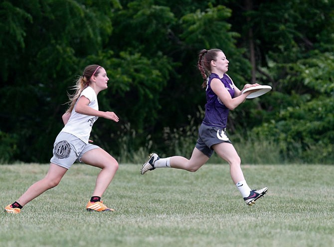 H-B Woodlawn’s Alex Gartner pursues Marlee Cobb of Yorktown-Washington-Lee in the state championship final.
