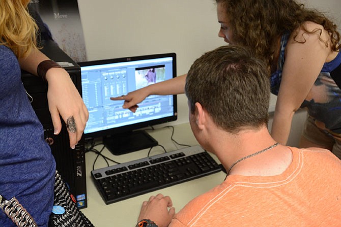 Robinson Secondary School Seniors in the International Baccalaureate intensive film studies program work together in a computer lab.