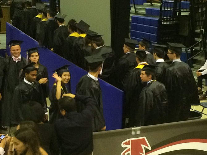 James Madison seniors ascend to the stage to claim their diplomas Wednesday, June 17. The high school’s Class of 2015 featured 470 members overall. 