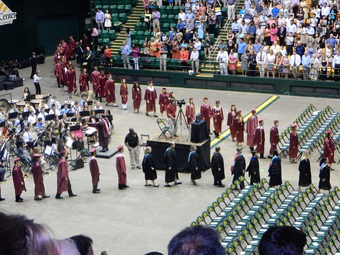 Students and faculty file into the Patriot Center.