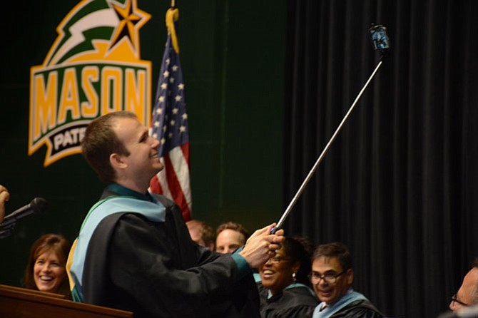 Edison teacher Michael Hohenwarter takes a selfie to begin his keynote speech to the graduating class of 2015.