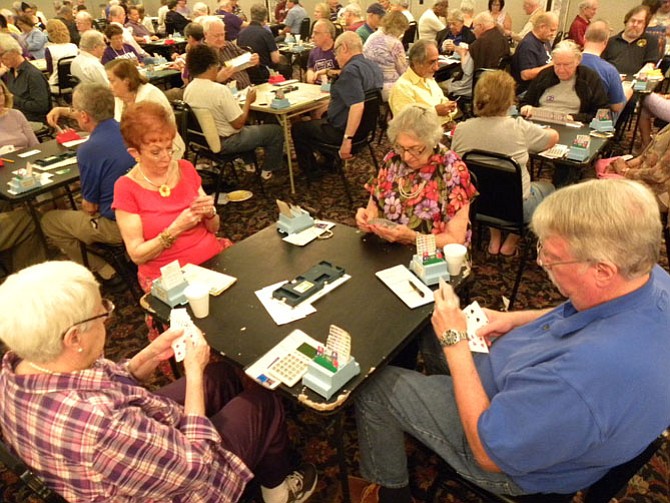 Participants of the bridge-a-thon play an intense but friendly game of bridge at Beth El Hebrew Congregation as part of The Longest Day-- a day to raise awareness and money for Alzheimer’s--on Sunday, June 21.