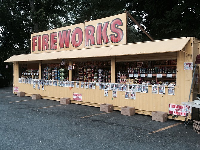 Fireworks are sold at a local stand at Lee Highway and N. Harrison Street in Arlington. Fireworks are synonymous with July 4th celebrations, but creating a fireworks display at home is illegal in some local jurisdictions.
