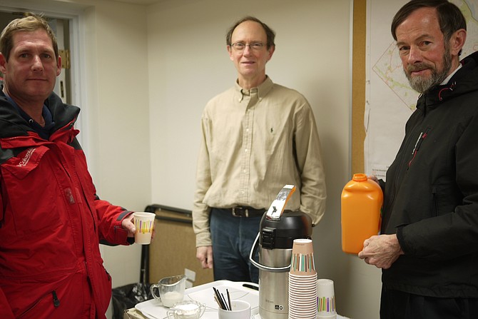 Feeding the homeless or economically disadvantaged at St. George's are Jon Churchman far right and Matt Argon center.
