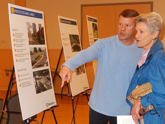 City Councilman Jeff Greenfield and resident Diane Henn discuss bike lanes in the project area. 