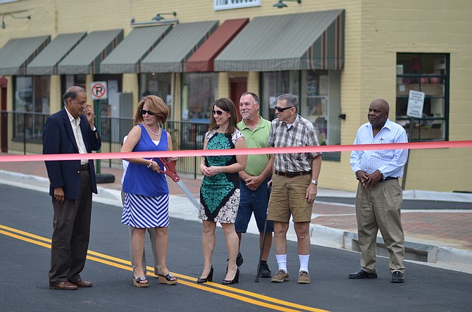 On June 16 residents of Herndon celebrated the reopening of the new and improved Station Street. Mayor Lisa Merkel, economic development manager Dennis H. Holste, Jr., former mayor Michael O'Reilly, Melissa Jonas and town councilmember Jasbinder Singh were some of the local officials who attended the ribbon cutting ceremony.