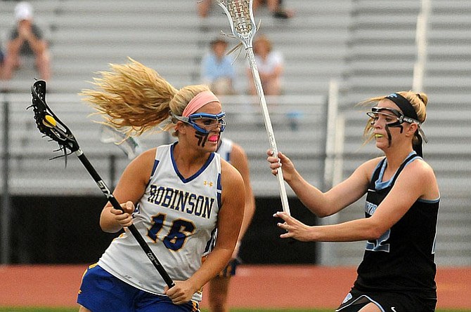 Centreville graduate Caroline Wakefield, right, will play lacrosse at the University of North Carolina.