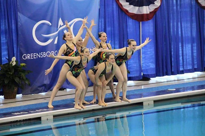 (Back, from left) Connie Polnow, Mikaela Voegele, Jackie Hafner (front, from left) Margot Baden, Angel Oh and Alex Marini perform a synchronized swimming routine for the 18-19 age group at the Junior Olympics.
