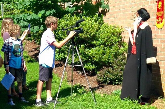 Johnathan Breaux (center) directs his political satire “Philmoria.”