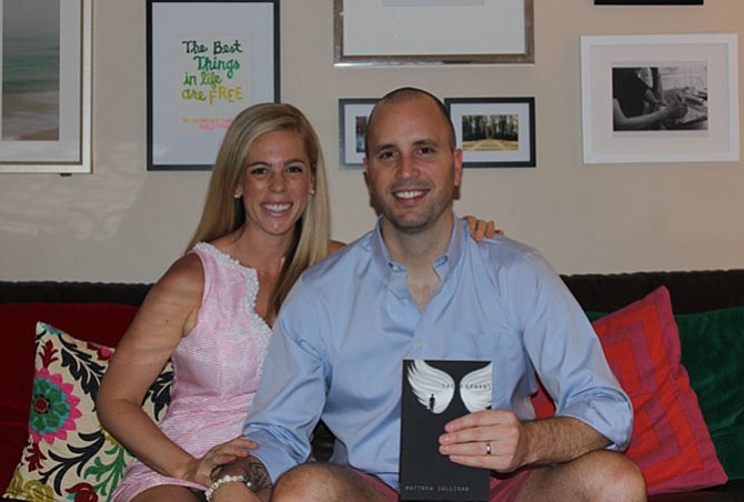Matthew Sullivan with wife Michelle and his book, “The Orphans.”
